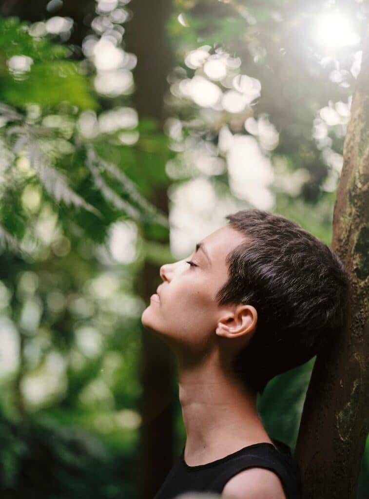 Girl leaning in the tree