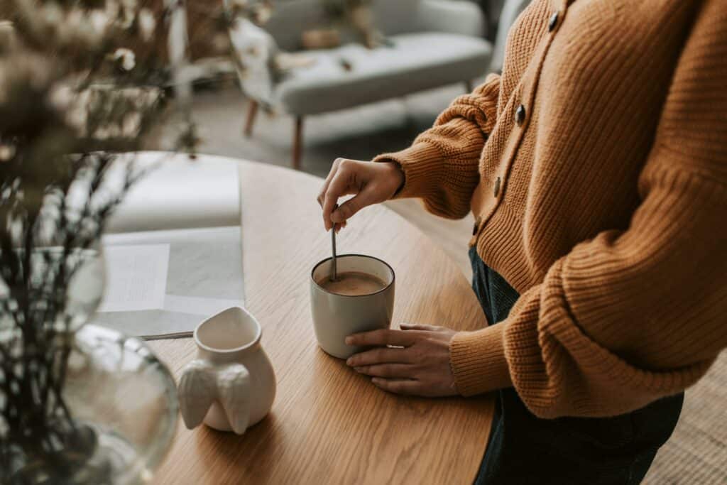 Woman preparing her coffee