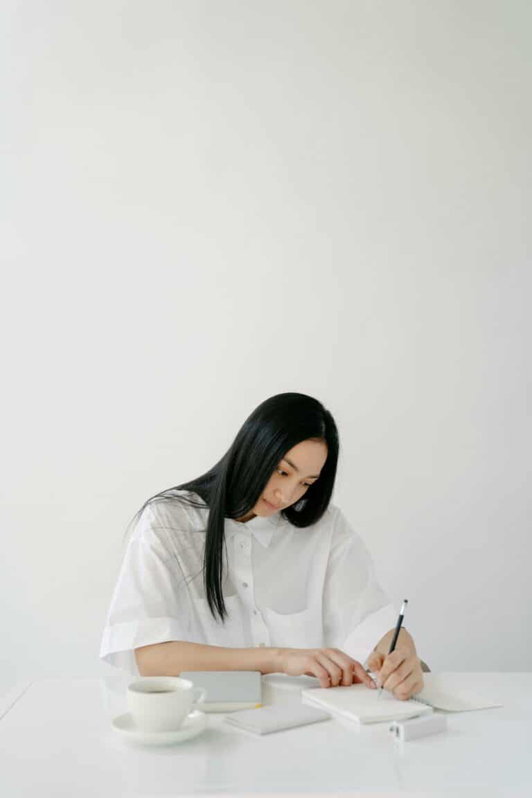 Woman writing on her journal